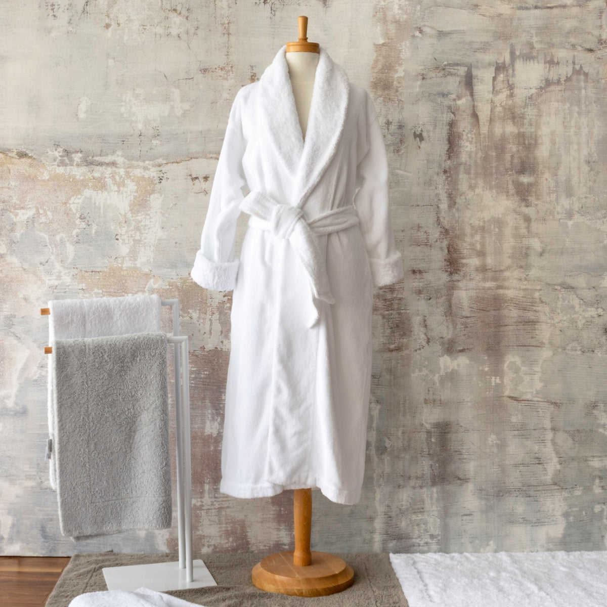 Abyss Comfy Robe in white on a stand